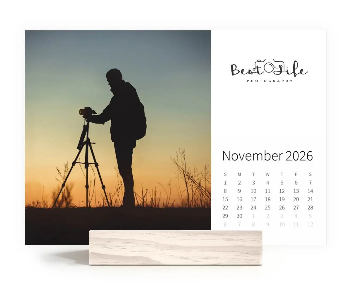 Desk calendar showing silhouette of a photographer at sunset with “Best Life Photography” branding and November 2026 calendar grid.