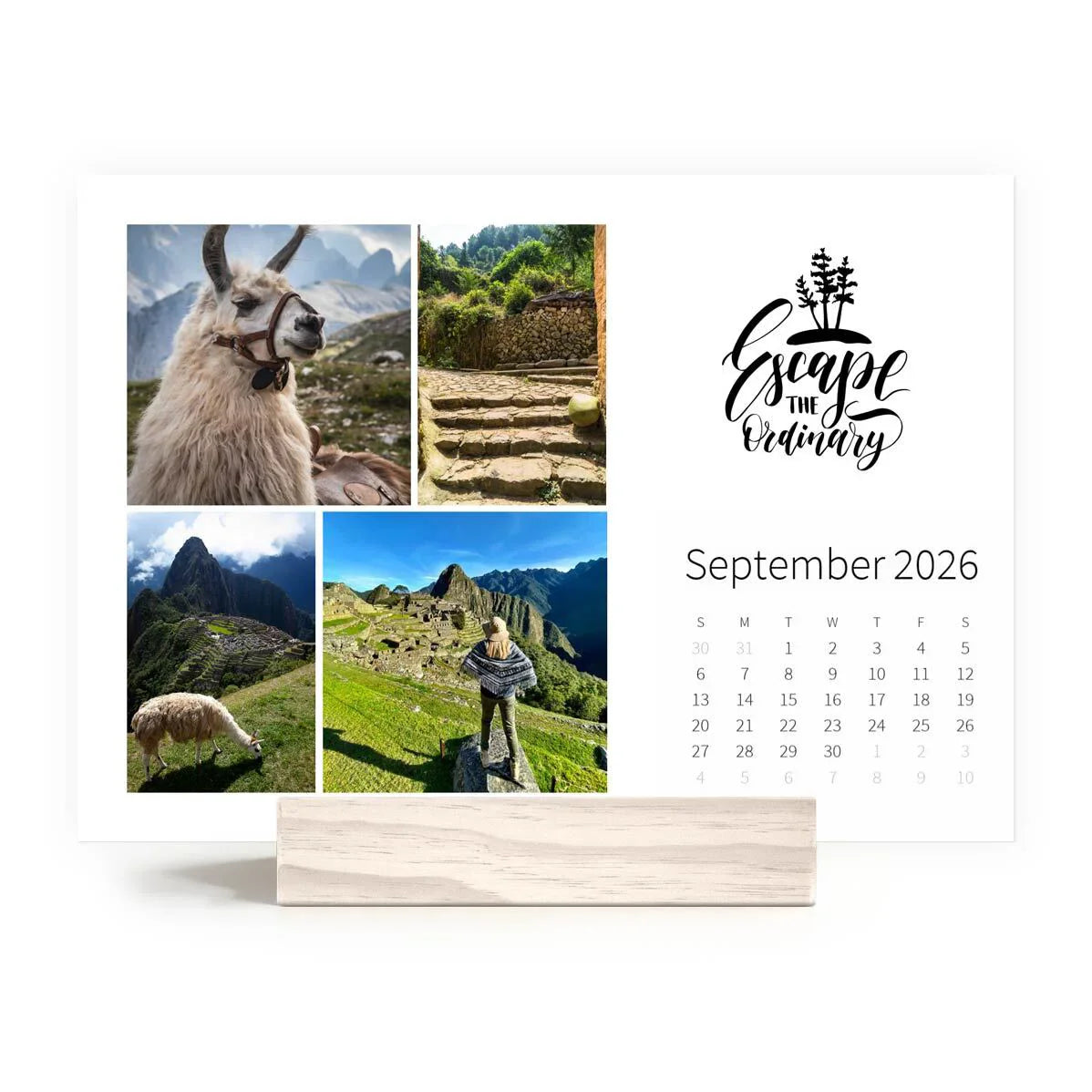 Desk calendar featuring travel collage with llama and mountain landscapes, “Escape the Ordinary” graphic, and September 2026 calendar grid.