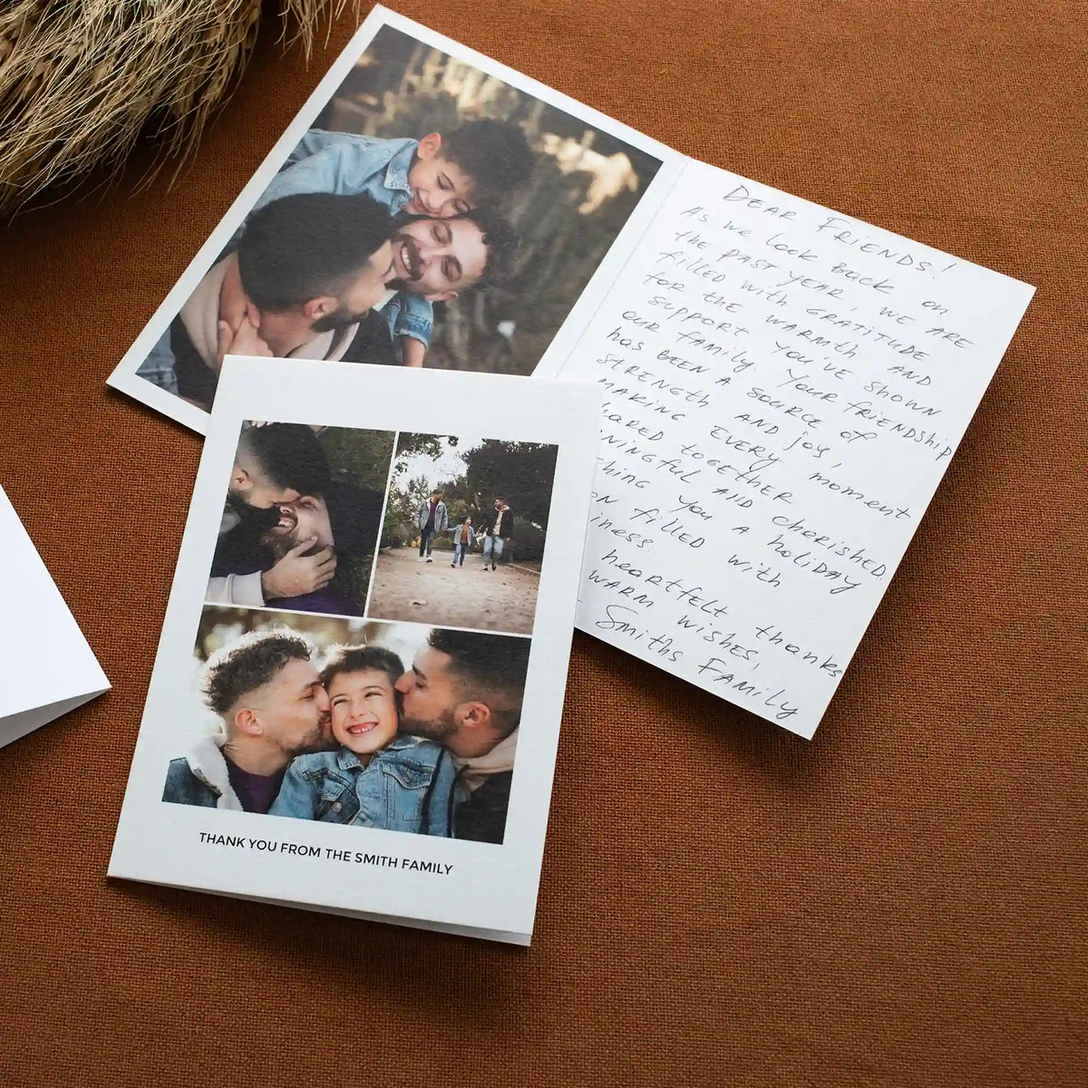 Open folded thank you card from the Smith family, showing father-son photos on one side and a handwritten note on the other.