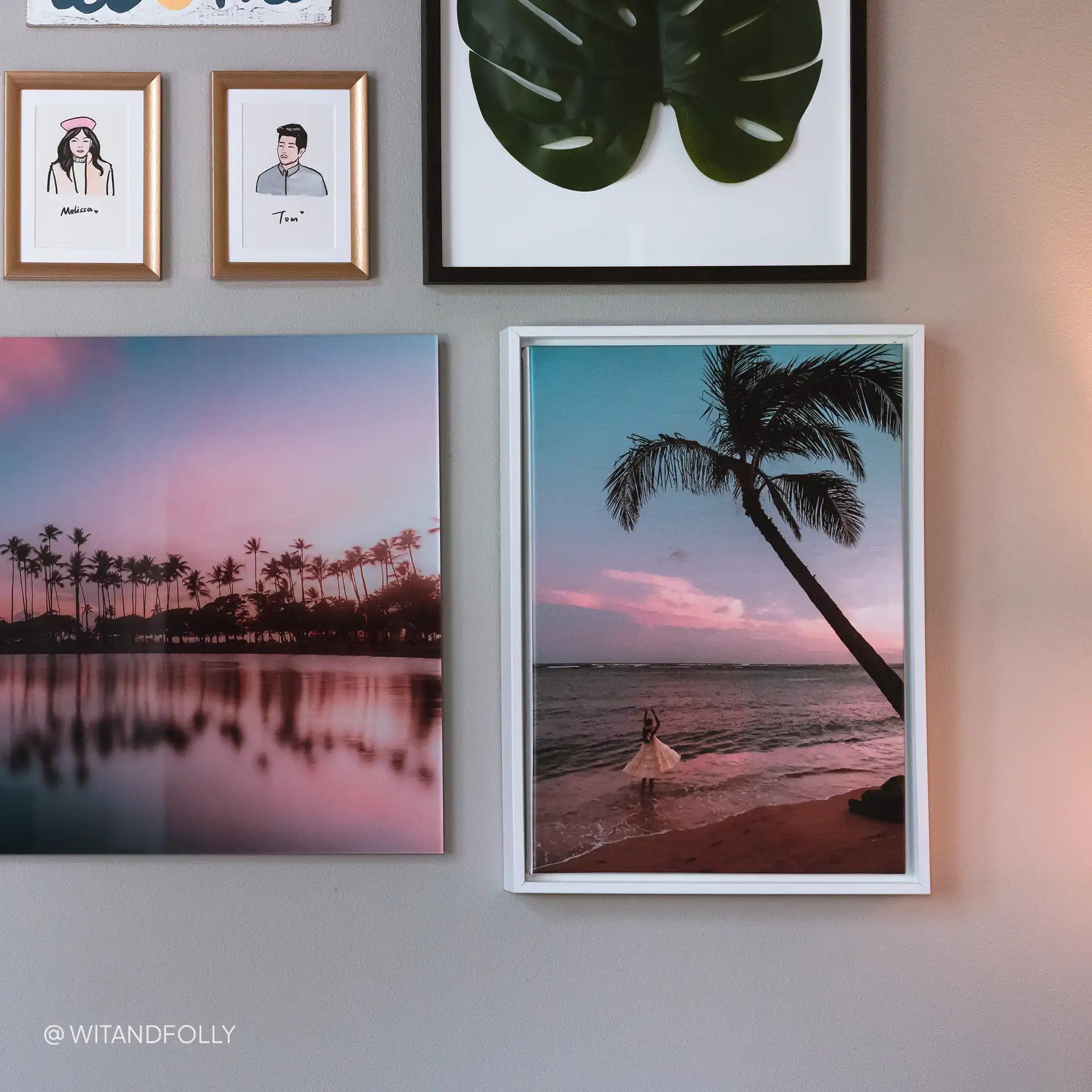 Framed canvas gallery wall featuring tropical sunset beach photography and botanical artwork arranged in coordinated frames.