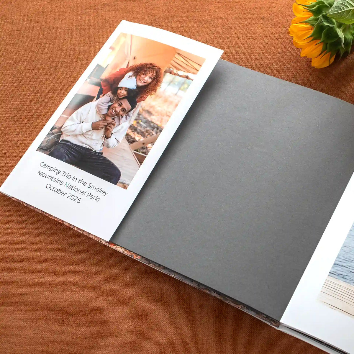 Hardcover photo book open to show the inside of the dust jacket with photo and caption.