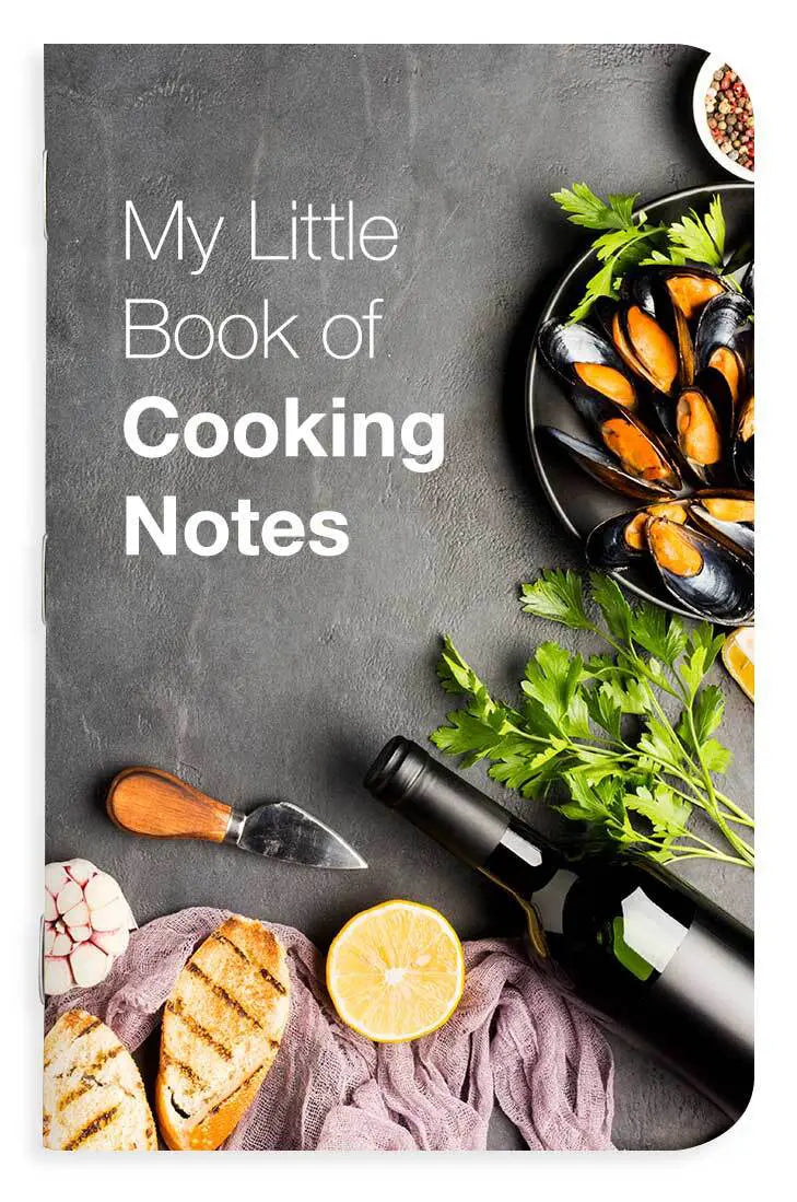 Memo book cover with mussels, lemon, bread, and a bottle on a dark background