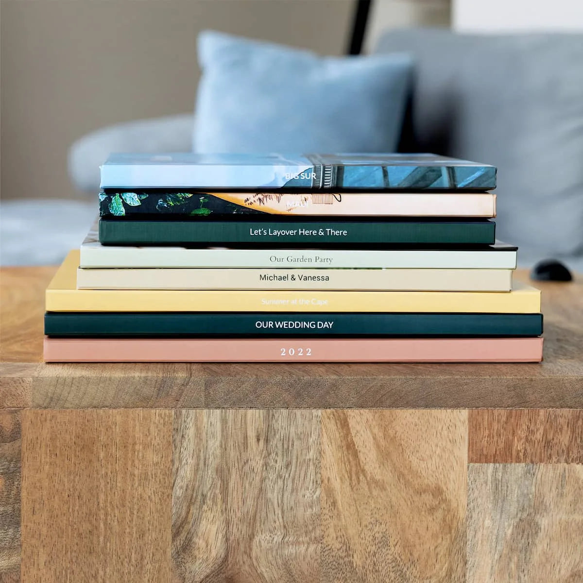 Stack of premium Apple photo books with custom covers and high-quality print finishes
