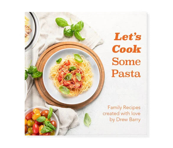 Softcover photo book cover featuring an overhead pasta dish with basil and tomatoes, titled “Let’s Cook Some Pasta.”