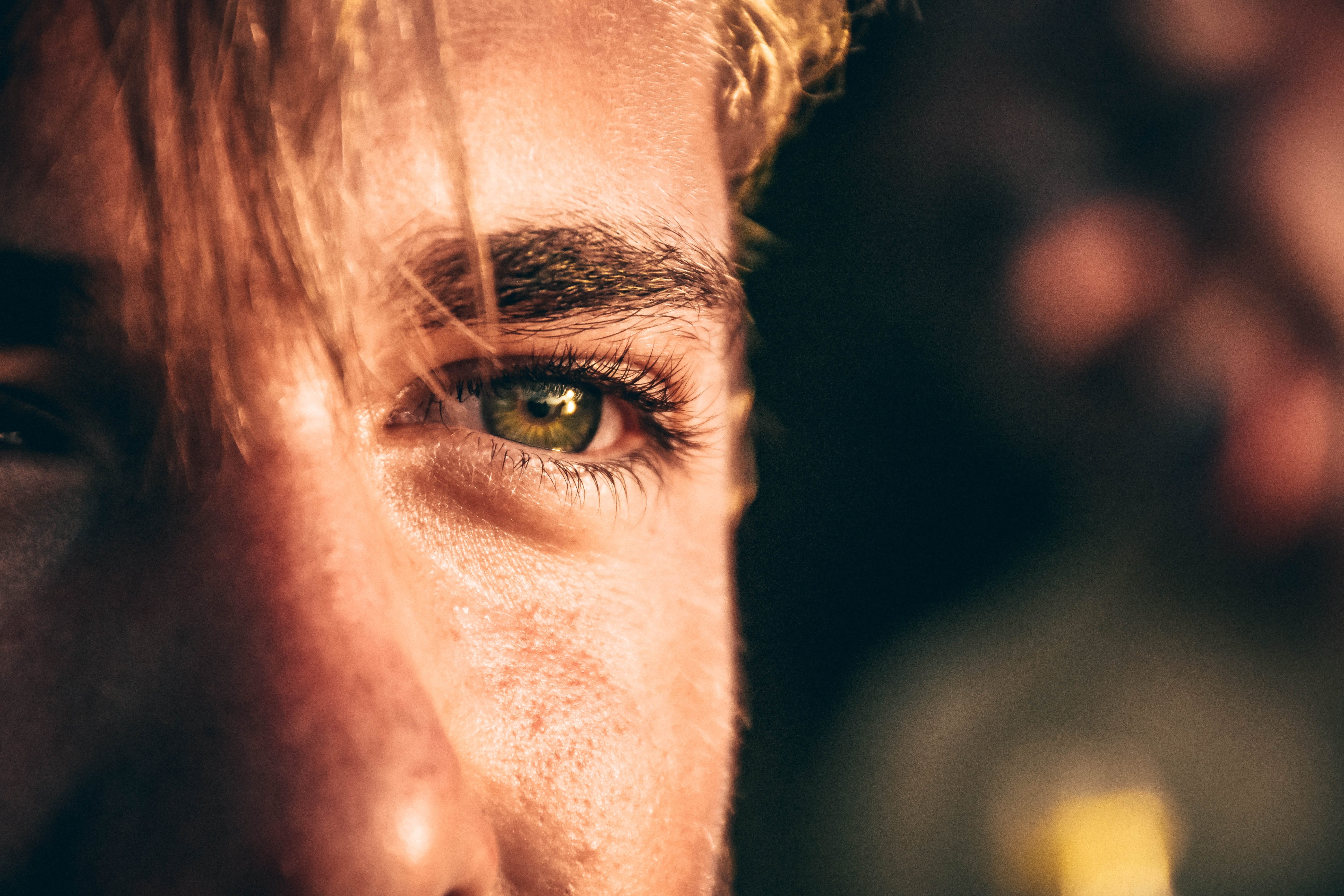 Green eyed man looking at sun