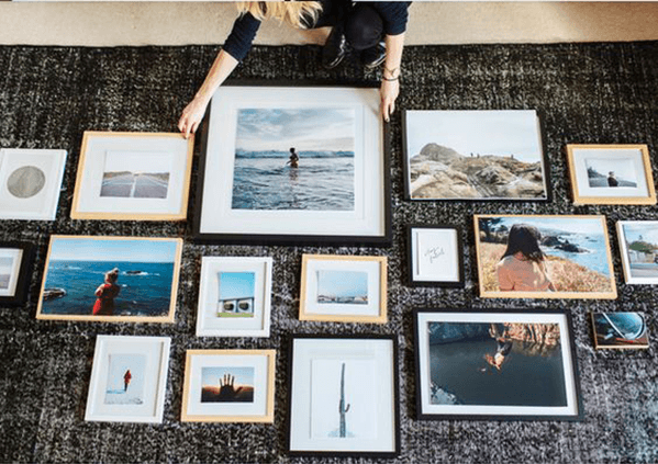 Plan the layout of your gallery wall on the floor first before hanging it
