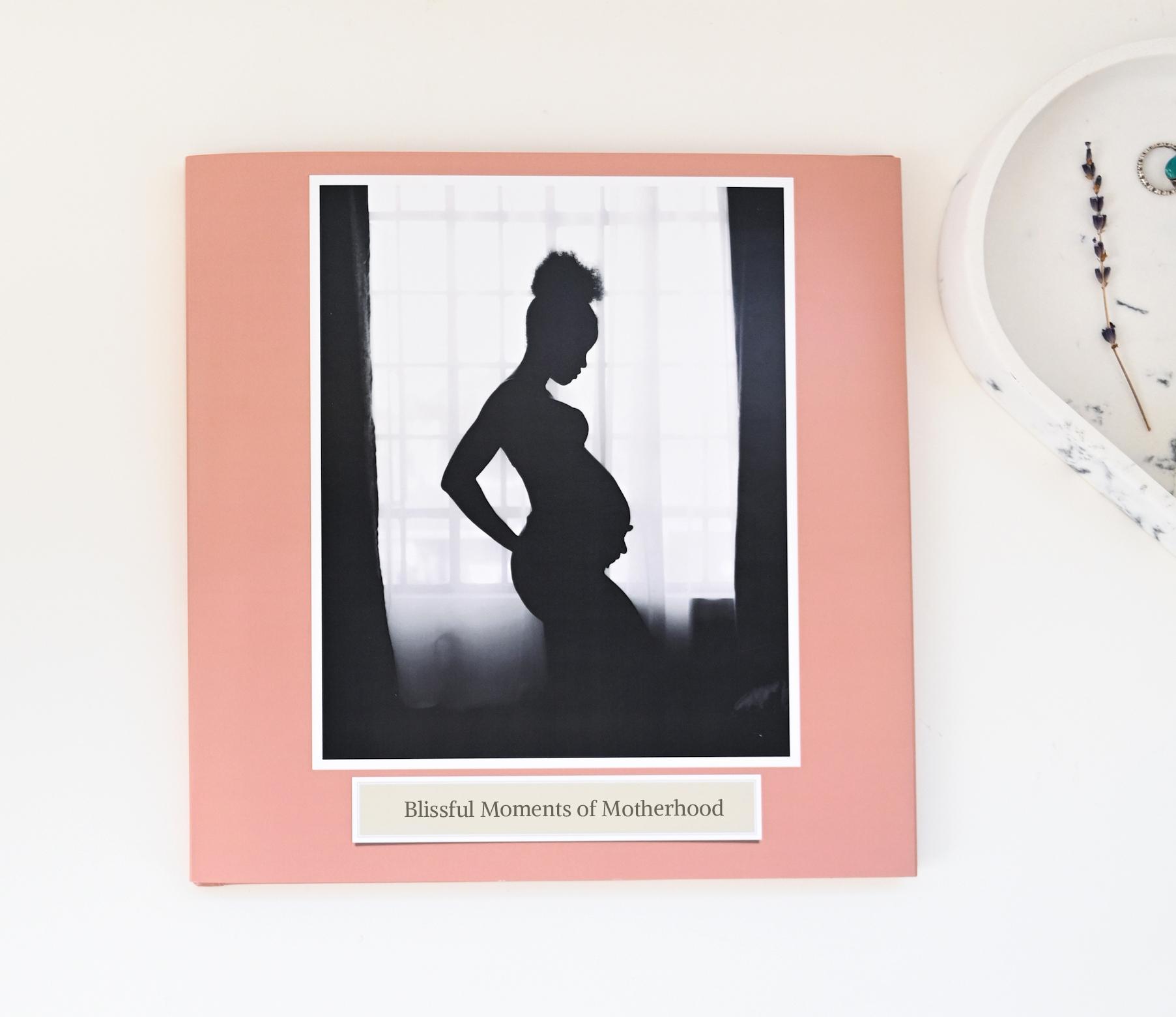 Blissful Moments of Motherhood photobook featuring maternity photography.