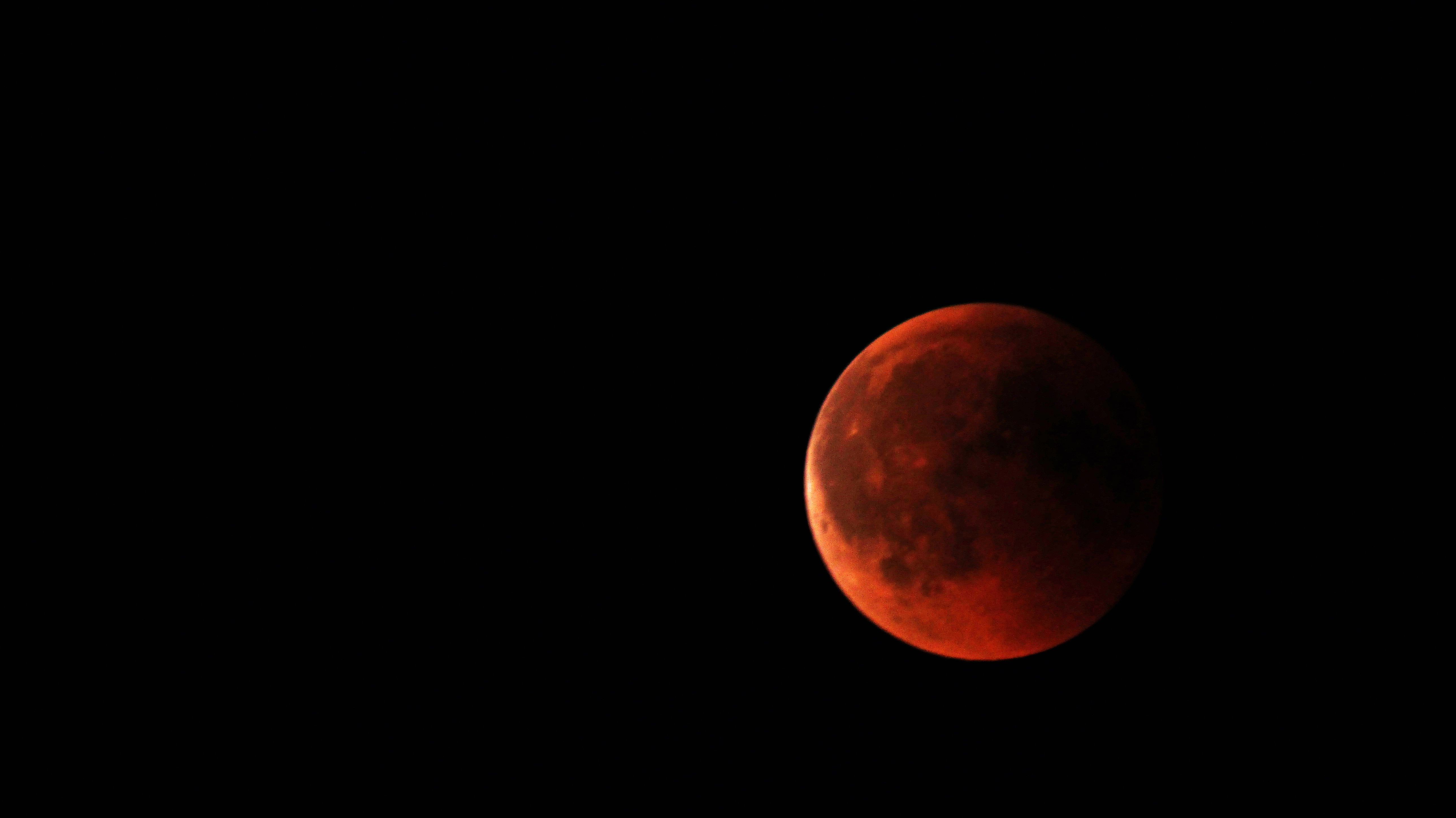 Take a lot of photos of the blood moon as it moves across the sky