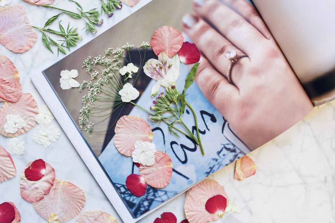 One of many romantic gift ideas is to press flowers into a photobook
