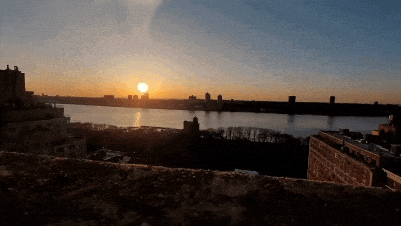 Timelapse video of a sun setting over the water.