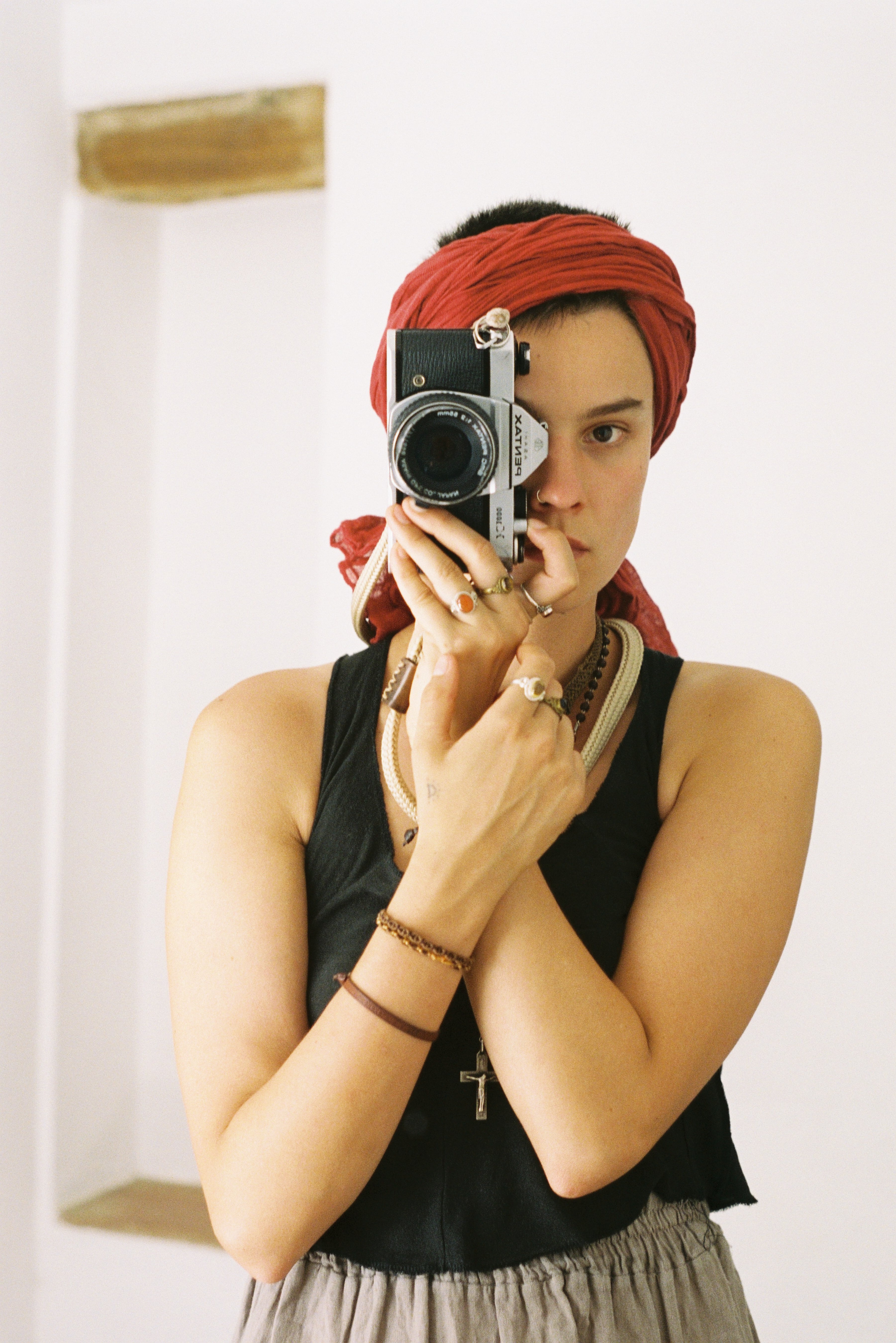Self portrait of girl with film camera