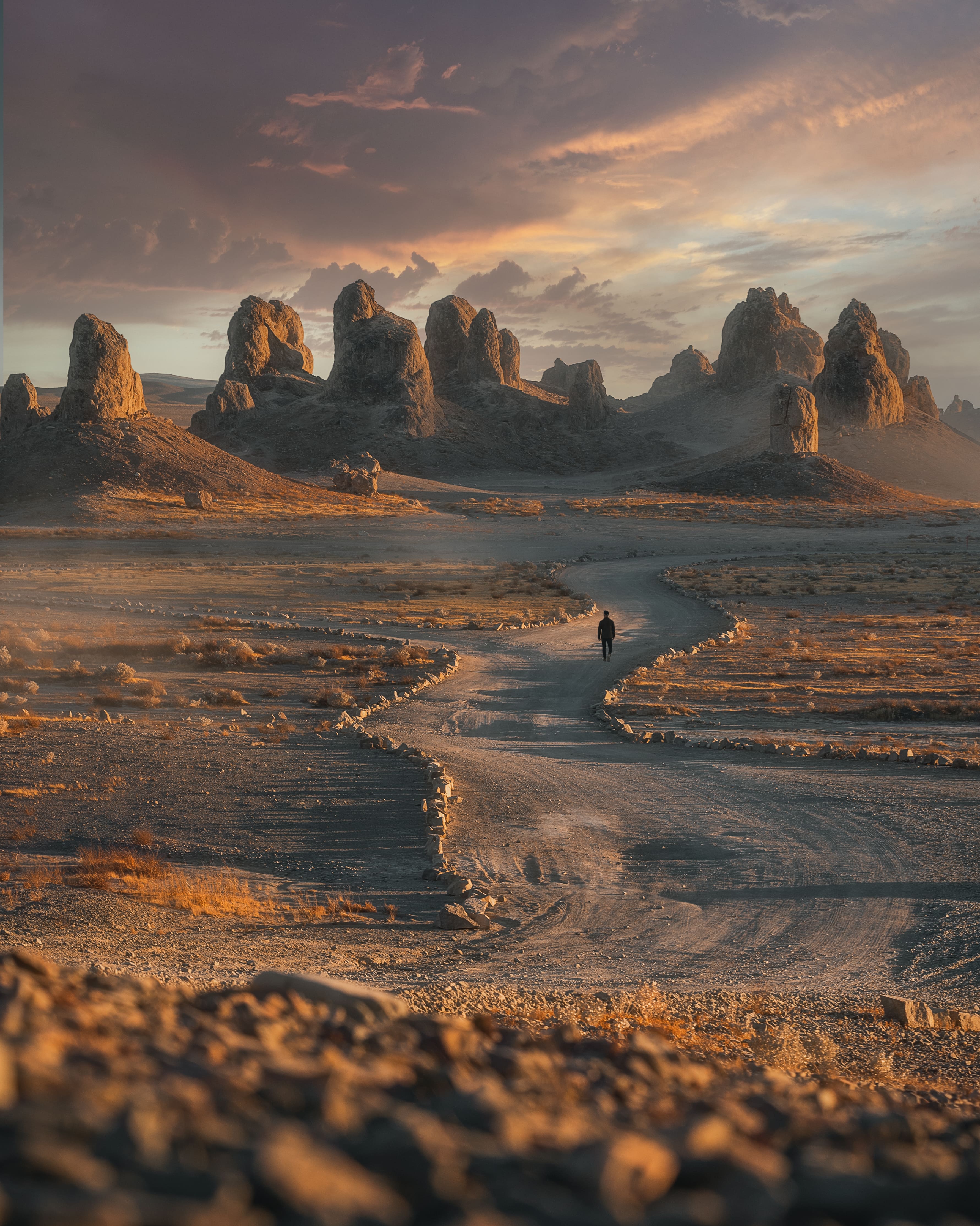 Man walking during sunset in the desert