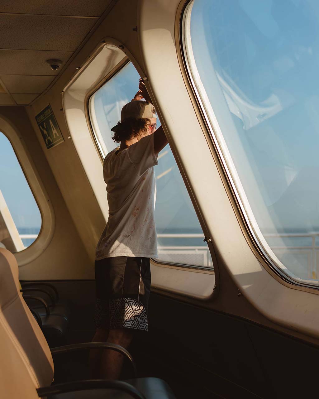 boy looking out ferry window