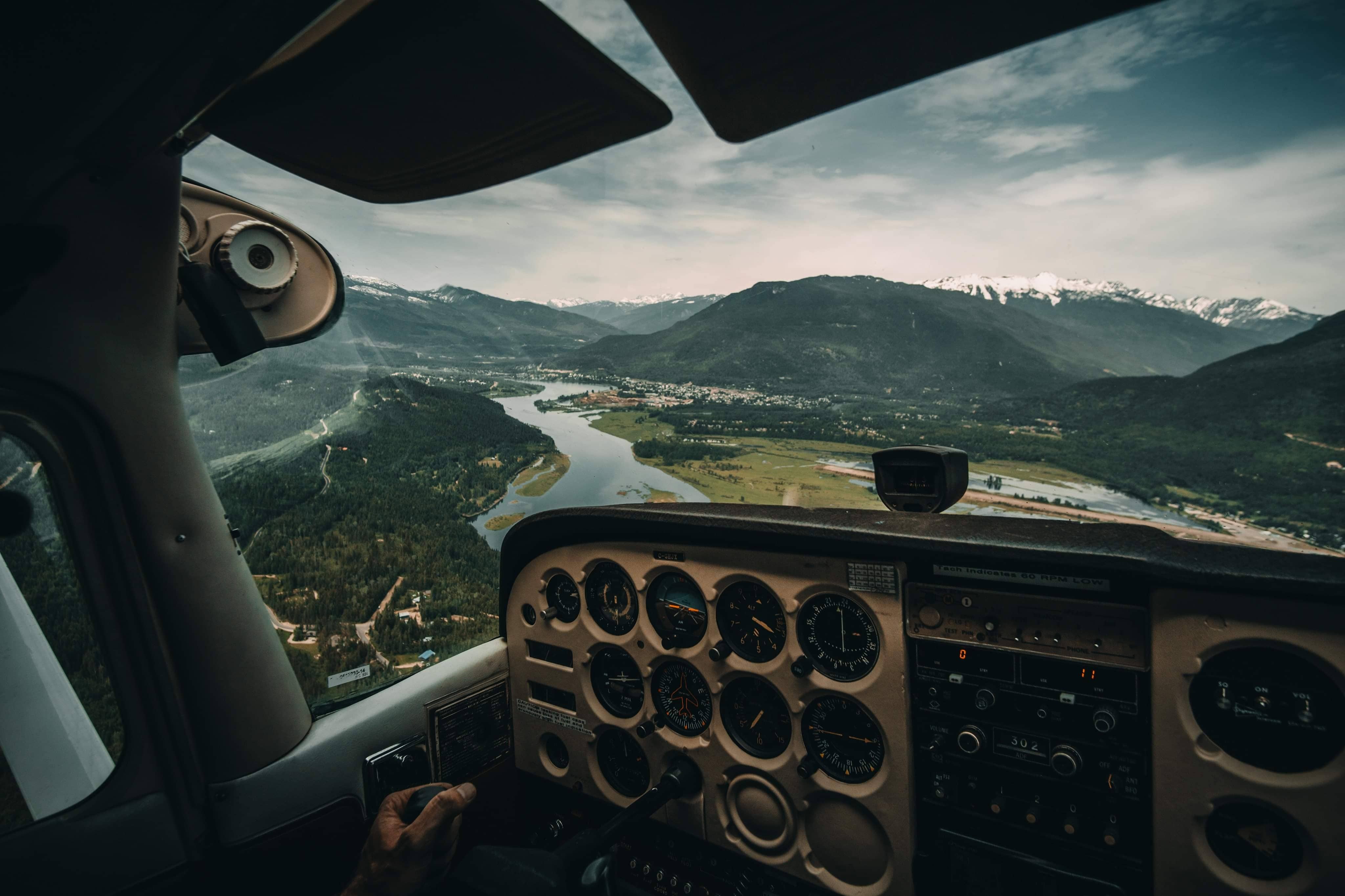 View from the Inside of a Plane Overlooking Mountains by Jordan McGrath