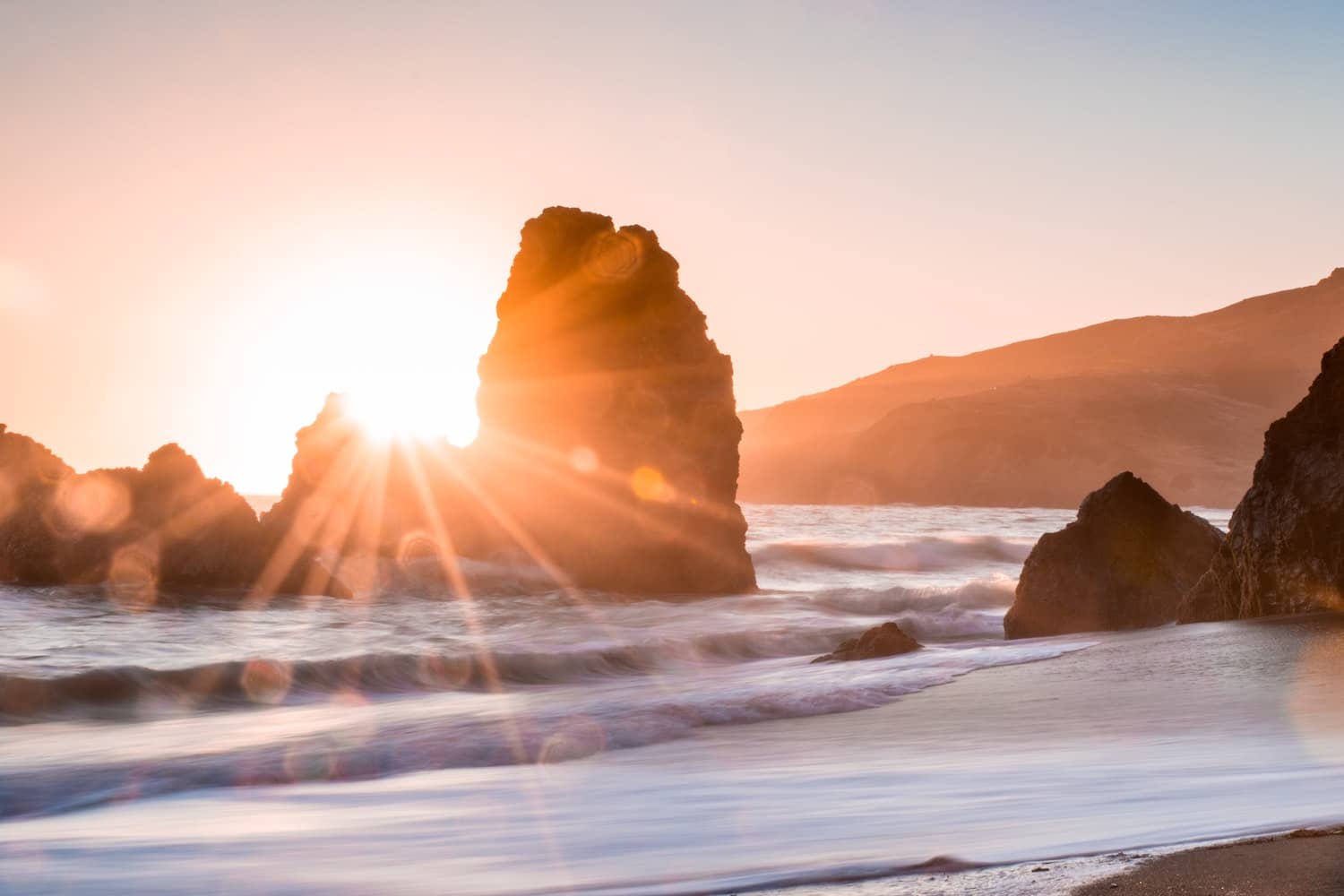 Sun stars make for magical subjects in your beach photography, try to capture them with these tips.