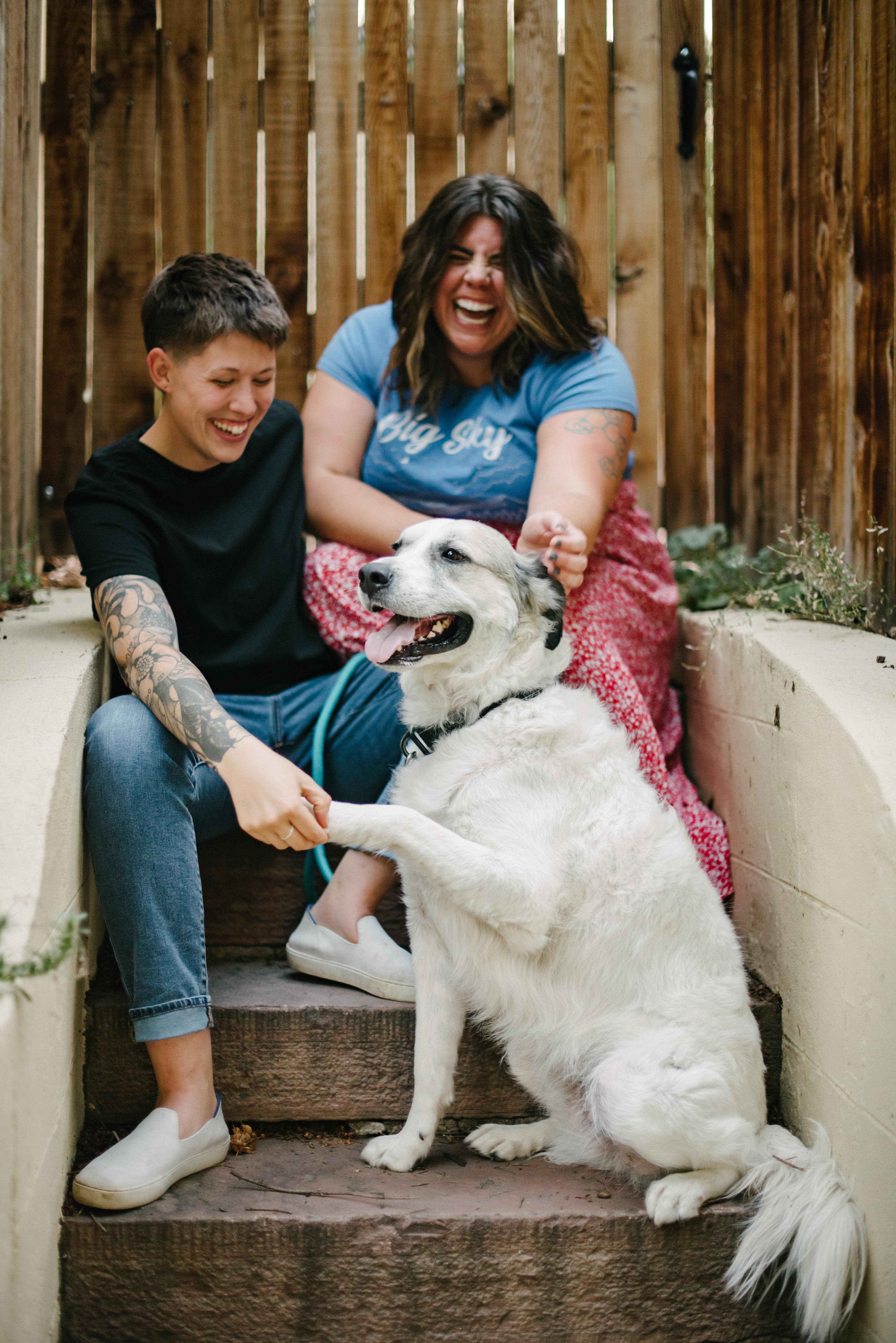 lgbtq+ photographer duo with dog posing for a picture