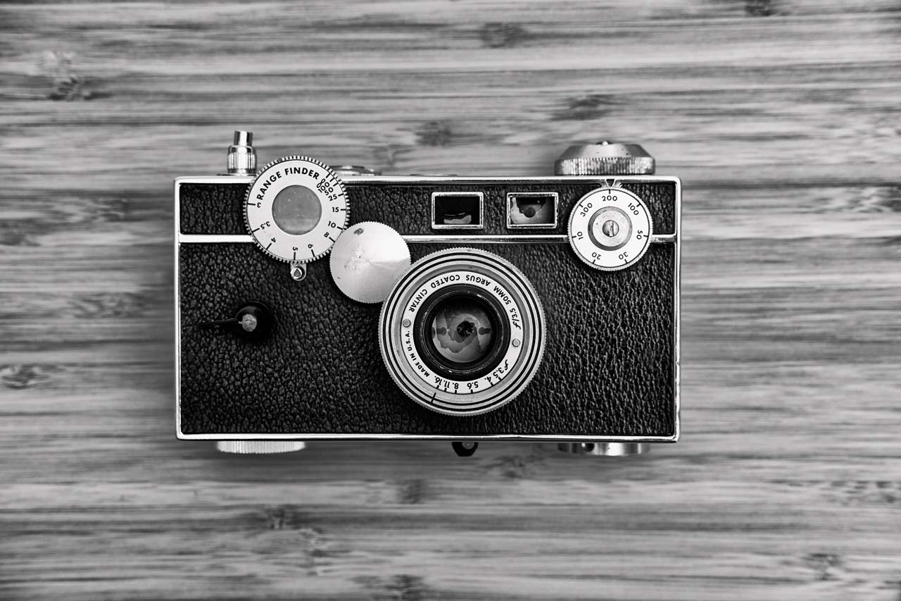 black and white vintage camera facing up 