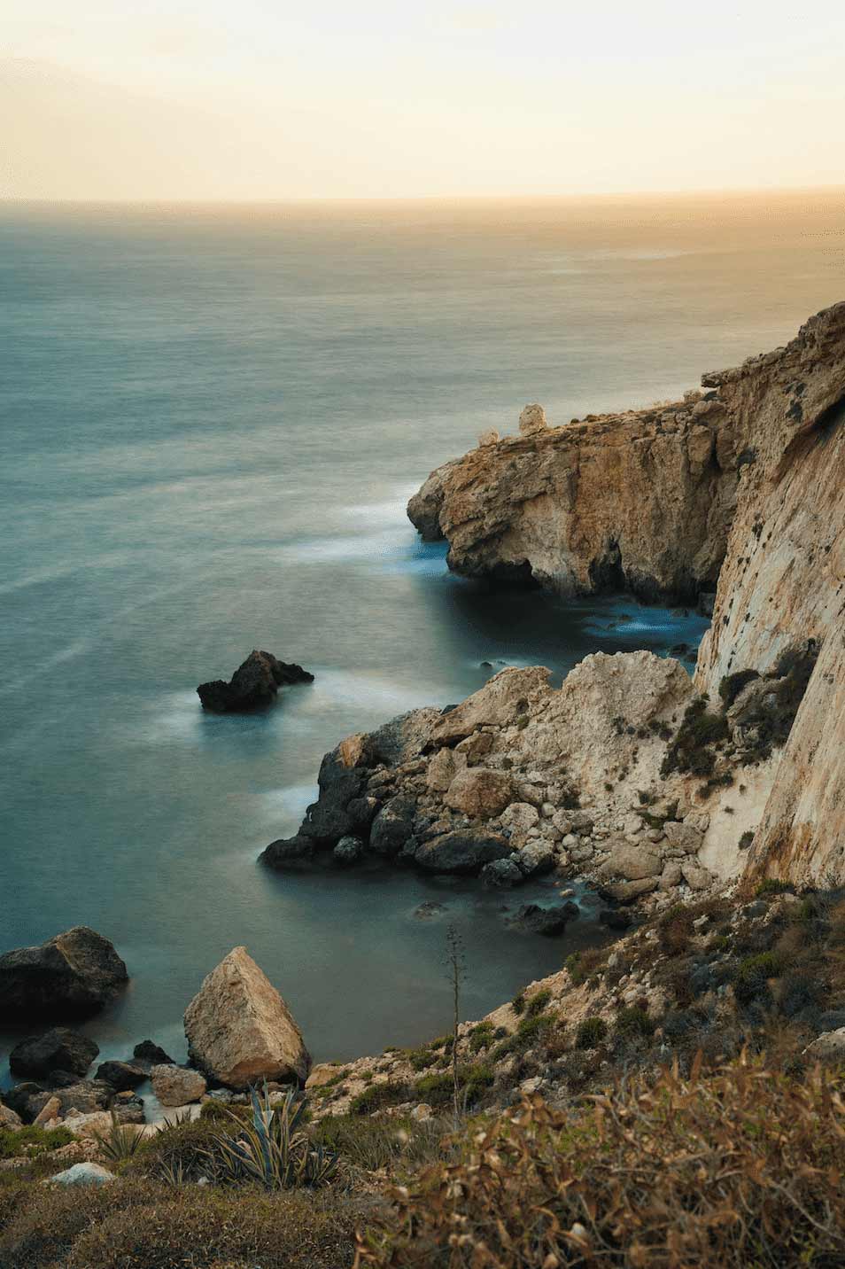 cliffs over the ocean at sunset