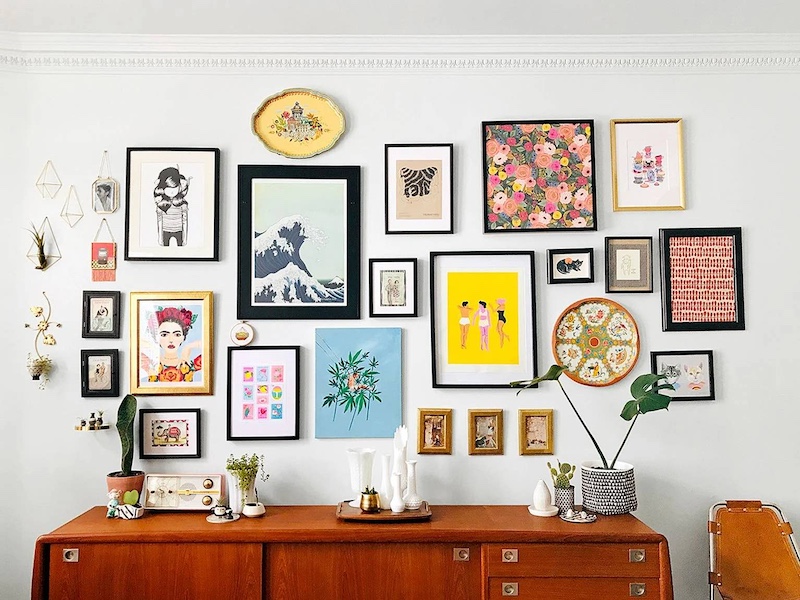 Add other objects to your gallery wall other than images to give it more personality