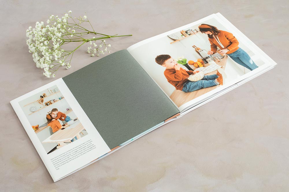 Open hardcover photo book showing a Mother's Day book dust jacket.